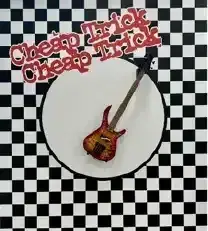 Checkered black-and-white background with a red guitar and stylized red text inside a white circle
